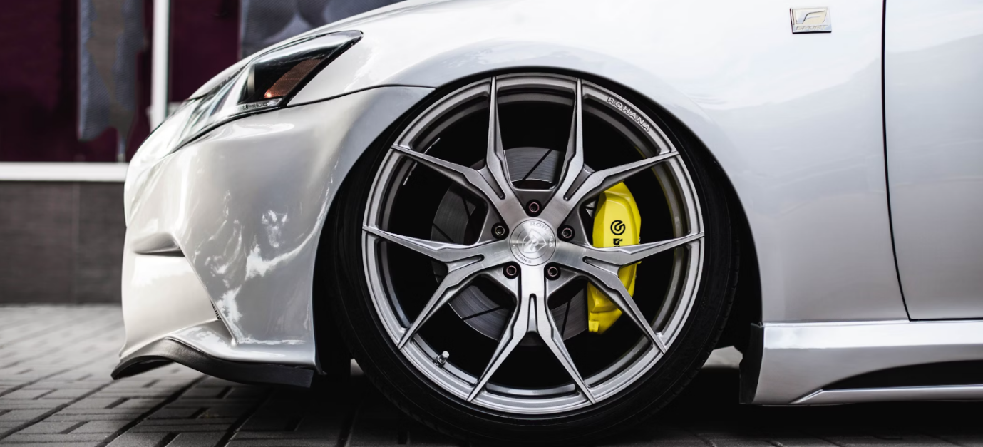 A car owner getting wheel alignment services.